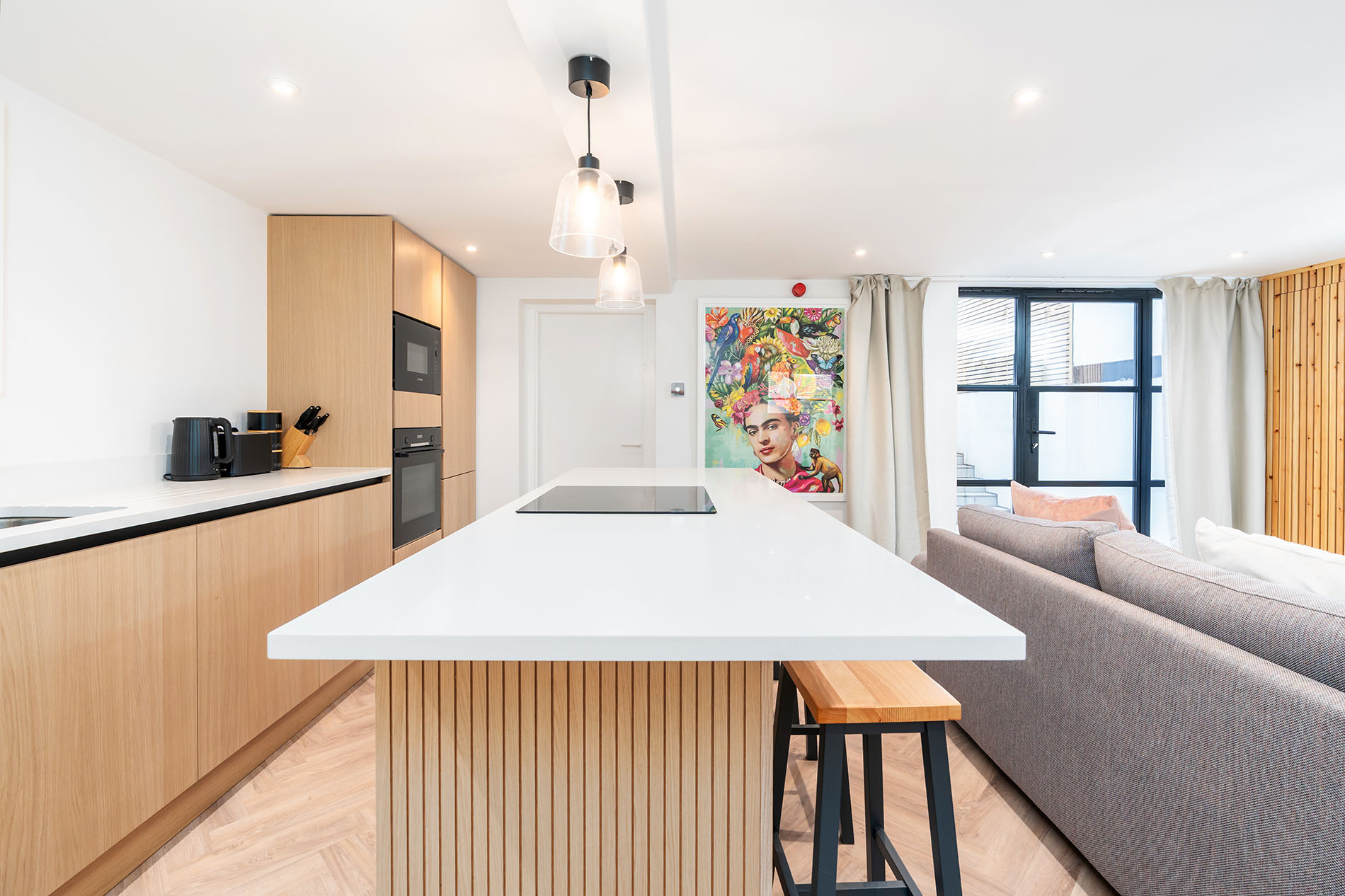 Living Area - First Bedroom Angle with Artwork